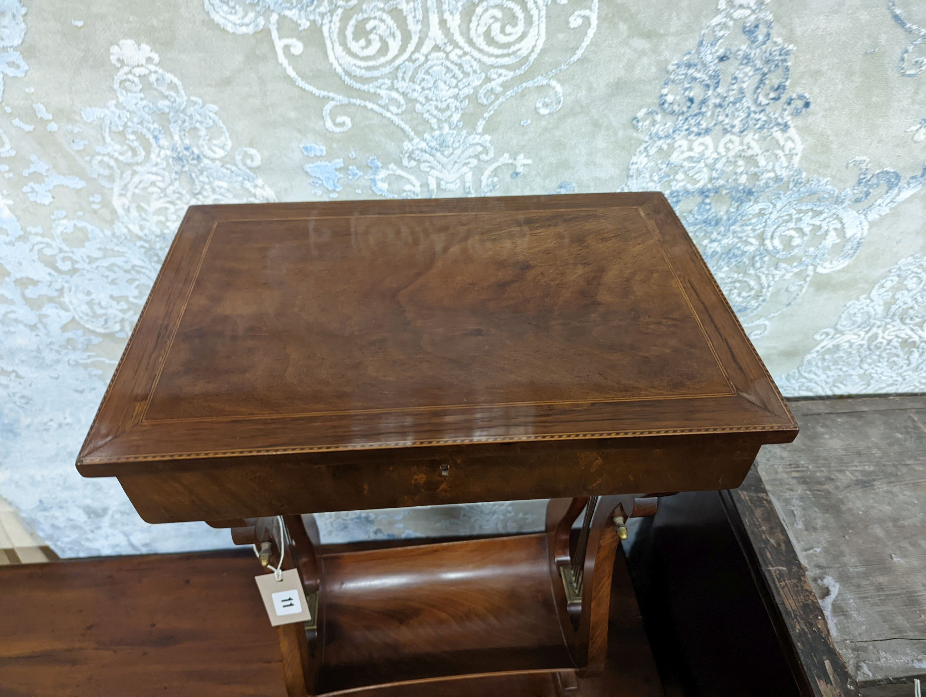 A reproduction Regency style mahogany work table on lyre supports, width 39cm, depth 27cm, height 69cm